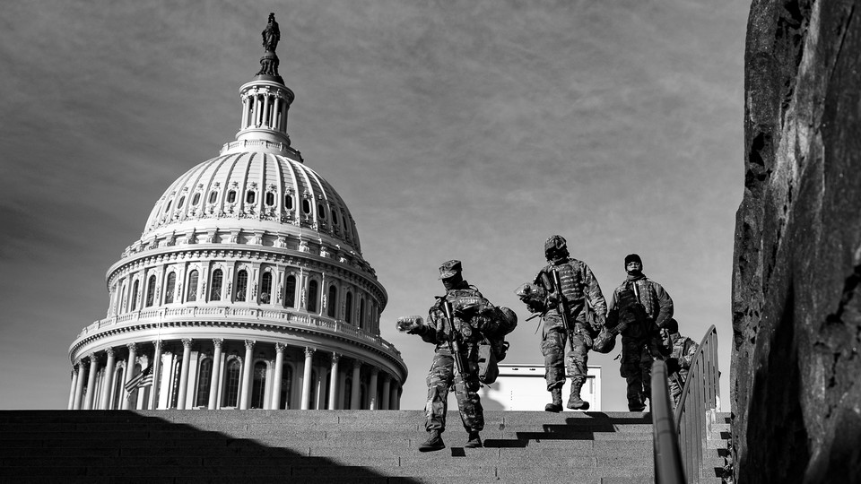 Security personnel near the Capitol dome