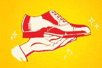 hand holding out a men's shoe