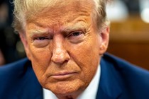 A photo portrait of Trump appearing in court.