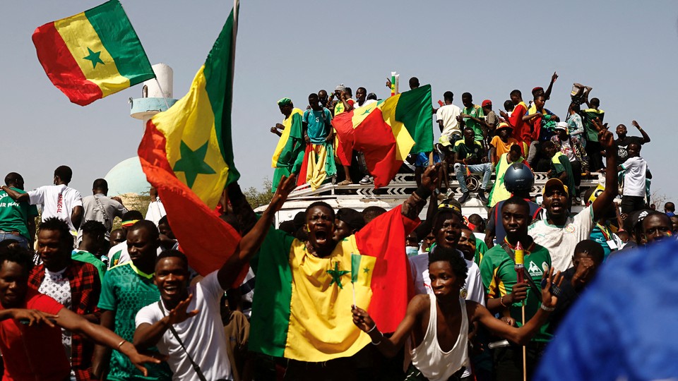 People celebrating the Senegal soccer team's victory