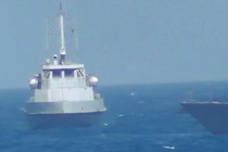An Iranian vessel steers close to the USS Thunderbolt on July 25, 2017. 