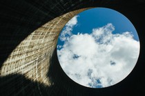 Exhaust from the Watts Bar Nuclear Plant Unit 1 cooling tower drifts over the opening of Unit 2, nearing completion, in Spring City, Tenn., Oct. 8, 2014. With aging coal-burning plants in need of expensive replacements, the Tennessee Valley Authority reasons the reactor is arriving at an opportune moment — even if almost every projection made over the last 44 years has proved wrong.