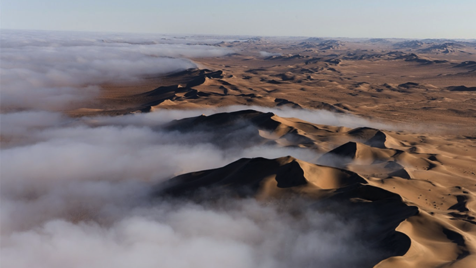 Fog rolling into the dunes of the Namib desert