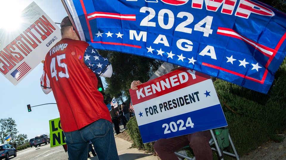Supporters of former U.S. president and 2024 Republican presidential candidate Donald Trump and of candidate Robert F. Kennedy Jr. gather near the entrance to the Ronald Reagan Library, in Simi Valley, California, on September 27, 2023.