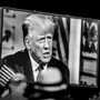 A black-and-white image of Donald Trump onscreen