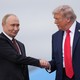 Photo of Vladimir Putin and Donald Trump shaking hands in Alaska
