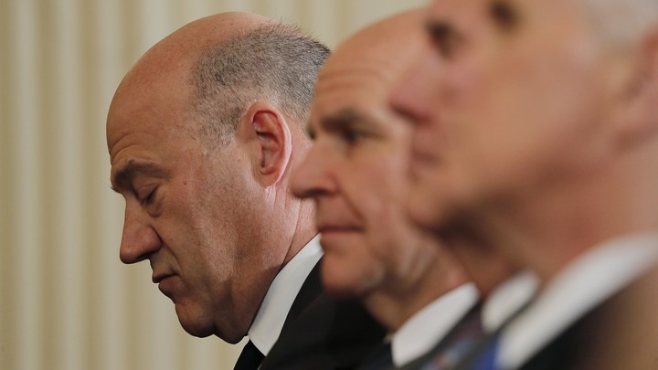 Gary Cohn looks downcast next to senior White House officials