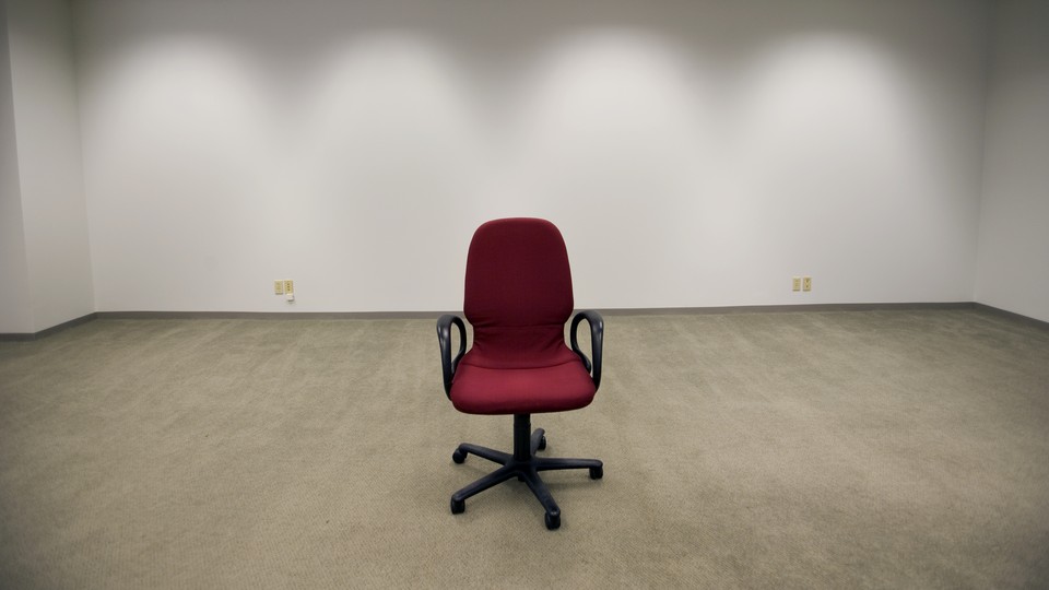 An office chair sitting in an empty room