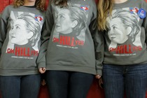 Three young women wear shirts that say, "oh HILL yes." 