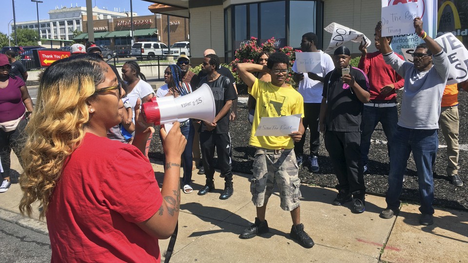 Activists rally for St. Louis businesses to keep higher wages despite a state law capping the minimum wage.