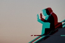 A silhouette of Donald Trump descending stairs