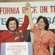 Dianne Feinstein and Barbara Boxer raise their hands in victory after securing the Democratic nominations for California's Senate seats.