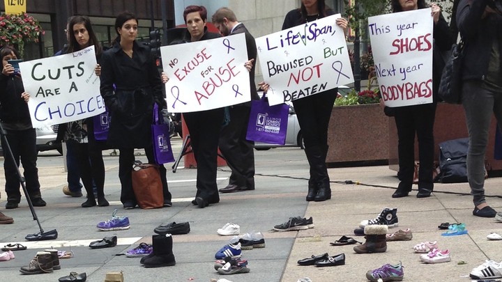 Advocates for victims of domestic abuse protest in downtown Chicago in 2015. 