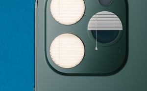 photo illustration of back of smartphone with 3-lens camera where 2 of the lens circles are covered by closed window blinds and the third lens is covered with half-open window blinds