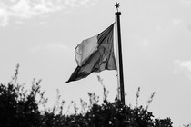 The Texas flag flies above city hall.