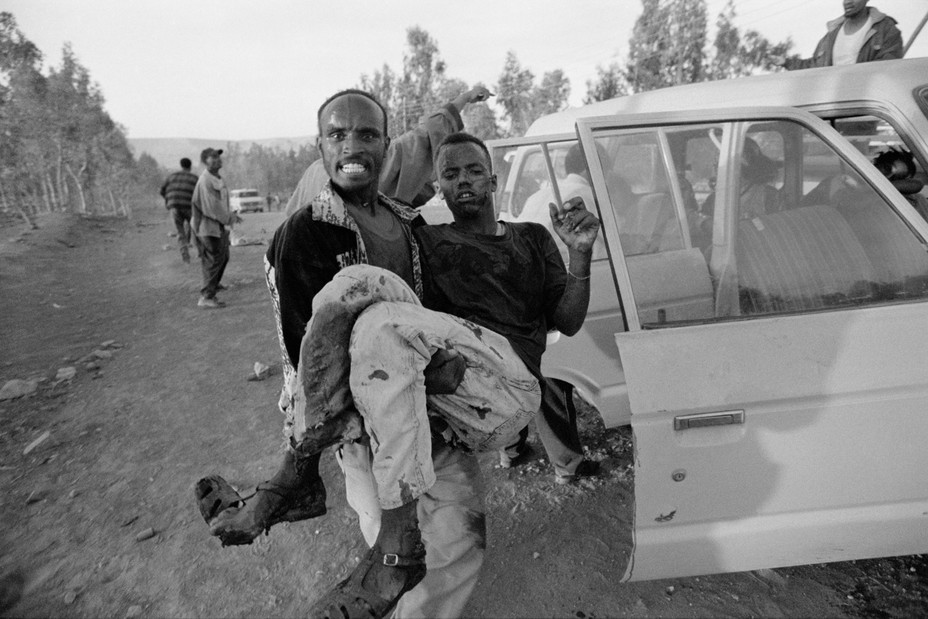 Picture of a man wounded during an Eritrean air attack on a civilian neighborhood in the capital of Ethiopia’s northern Tigray Region, being carried from the scene minutes after the attack.