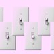 A row of light switches in on and off positions
