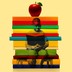 A photo of a young black student, reading a book, is overlaid on an image of a stack of books with an apple on top