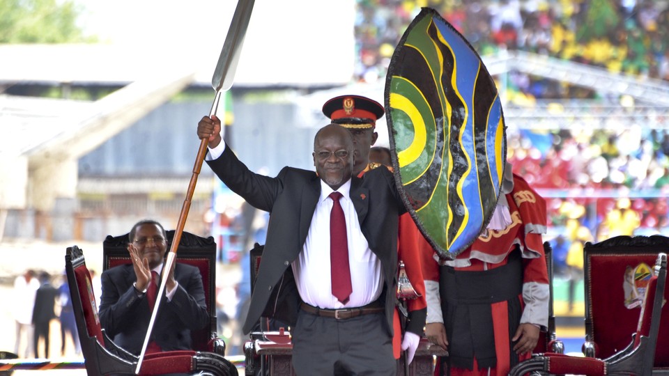 At his inaugural ceremony in 2015, John Magufuli holds a ceremonial shield and spear to signify the beginning of his presidency.