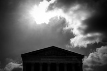 Supreme Court building on a cloudy day