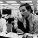 A black-and-white photograph of Carl Bernstein and Bob Woodward at the Washington Post offices