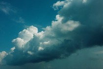 A photo of blue-tinted clouds in a blue sky