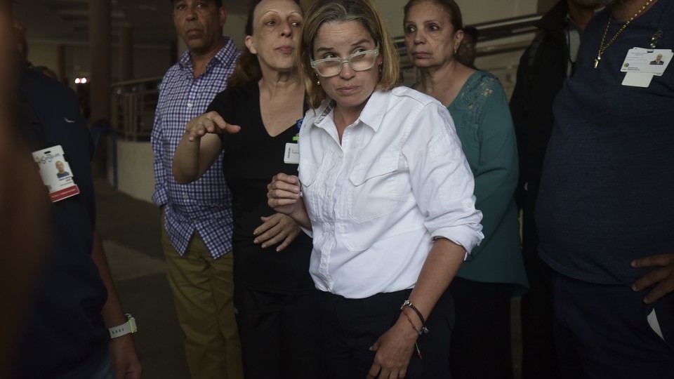 Mayor Carmen Yuliín Cruz visits a hospital in San Juan Saturday, after electrical outages requires patient evacuations.