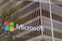 The Microsoft logo reflected in a window