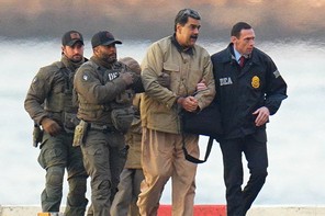 A photo of Nicolas Maduro being escorted by U.S. agents