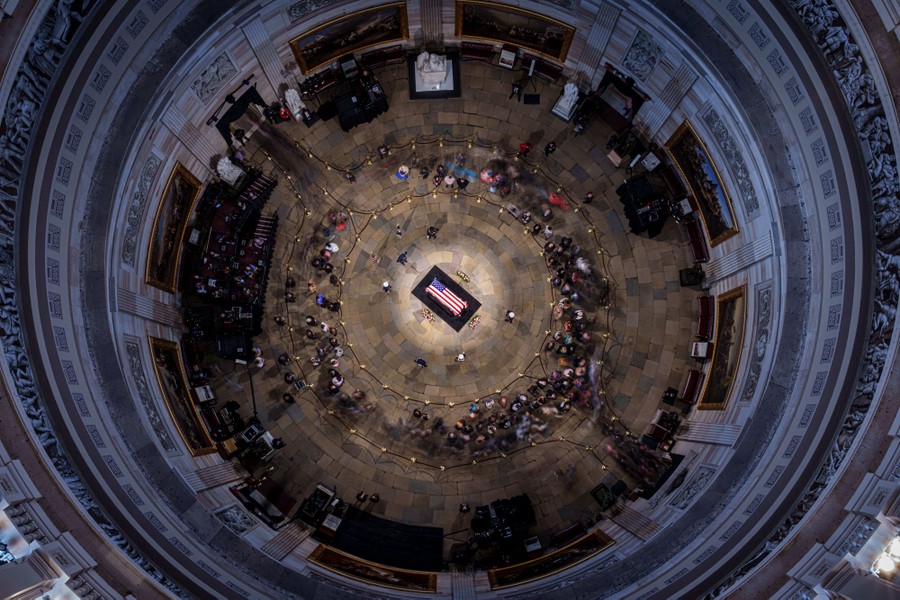 An overhead view of a flag-draped casket inside the U.S. Capitol Rotunda