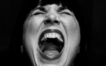 A close up of a woman screaming