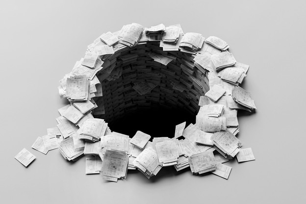 A black-and-white photo-illustration of sets of white paper packets, resembling printed research papers, stacked in a circle with a hole in the center plummeting into darkness.
