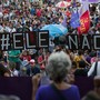 Demonstrators protest in Rio de Janeiro days before Bolsonaro was elected. They told a large sign saying "#EleNao," or "#NotHim."