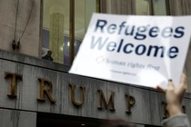 Protesters gather outside the Trump Building to take action against America’s refugee ban.