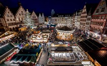 An elevated view of a brightly lit Christmas marketplace