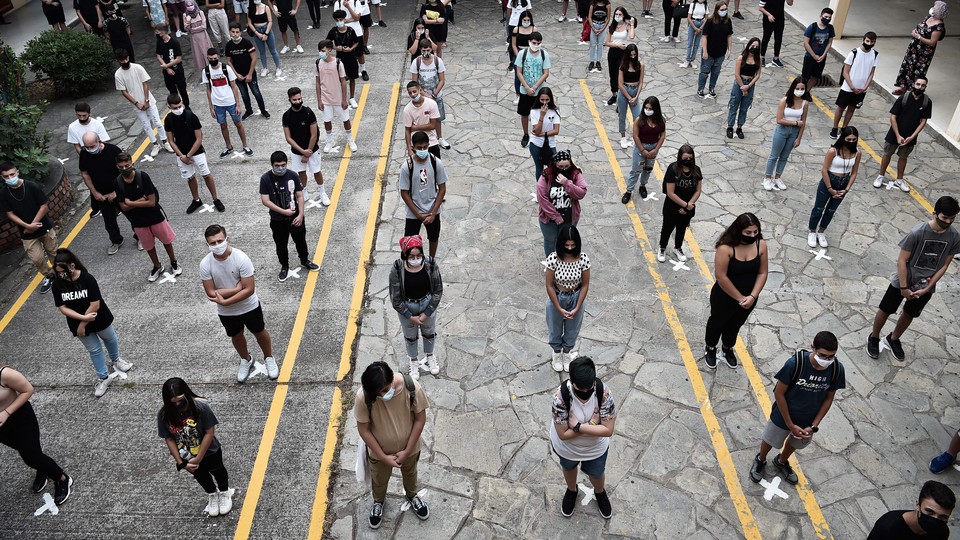 High-school students socially distance in Greece.