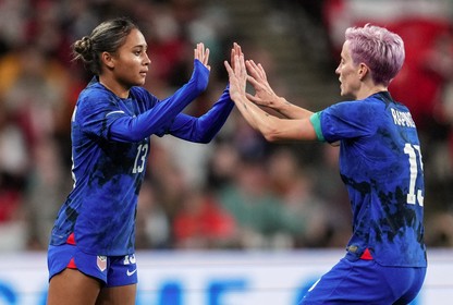 Alyssa Thompson substituting in with Megan Rapinoe in a soccer match