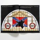 Photo of magazine spread for story "The War on Nostalgia" with shattered stained-glass confederate flag