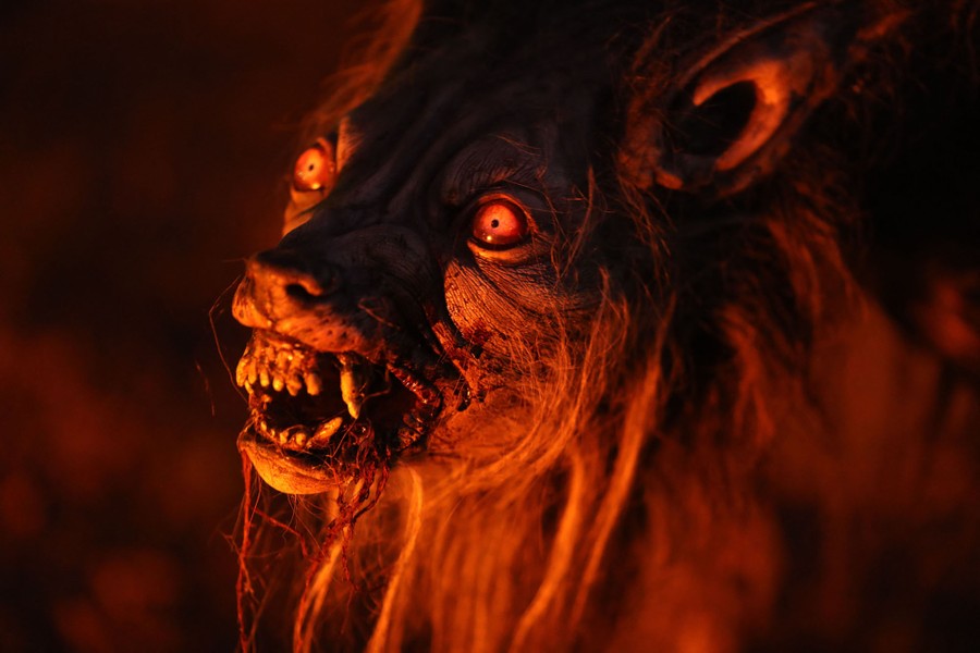 A close view of a scary prop that looks like a werewolf.
