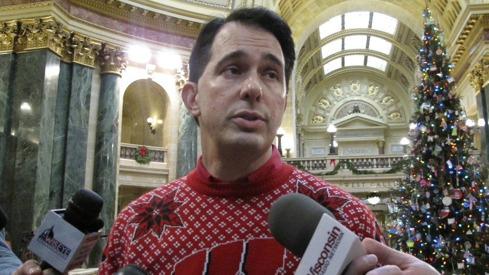 Wisconsin Governor Scott Walker speaks to reporters.