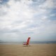 A folding chair on a beach