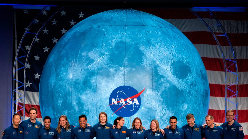 American and Canadian astronauts, who will someday be eligible to train for future moon missions, pose for a picture