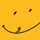 figure running up the smile of a smiley face, tripping and sliding back down