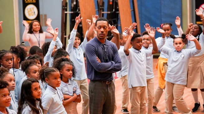 Tyler James Williams surrounded by young students, in "Abbott Primary"
