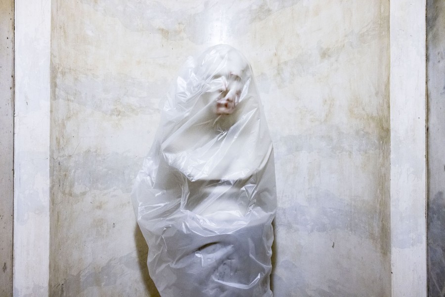 A plastic sheet covers a blood-stained bust of U.S. President Zachary Taylor.