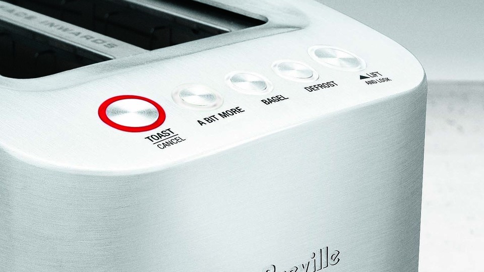 A Breville toaster with the "A Bit More" button