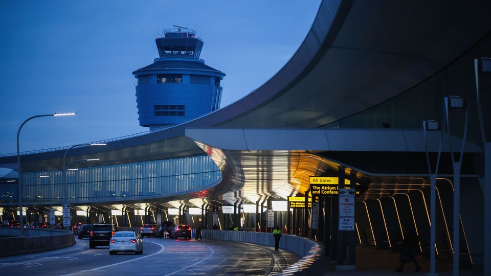 An air-traffic-control tower at LaGuardia airport, at night