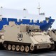 U.S. tanks and other military equipment being unloaded in the German port of Bremerhaven