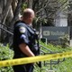 Police officers stand guard outside YouTube headquarters. 