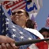 A photo of Latinos demonstrating with American flags